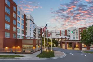 an rendering of the exterior of a hotel at Embassy Suites Charlotte/Ayrsley in Charlotte