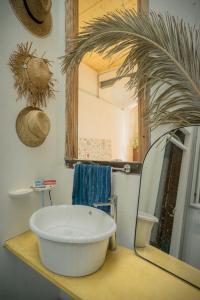 a bathroom with a large mirror and a tub on a counter at Casa compartida de Santi in Montevideo