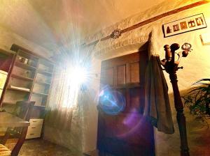 a beam of light shining on a wall in a room at Vojko Holidays - Rustika in Koper +3 photos