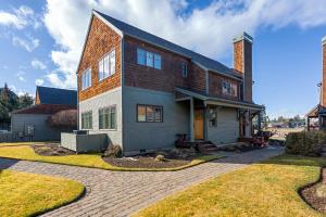 a large house with a brick at Big Mountain View Condo in Sisters