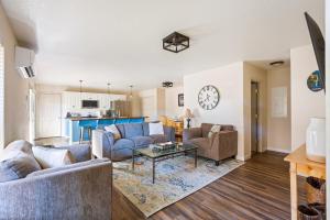 a living room with two couches and a table at Timber Creek Escape in Sisters