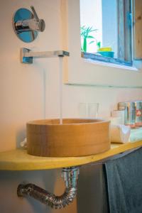 a bathroom sink with water coming out of it at Casa compartida de Santi in Montevideo +5 photos