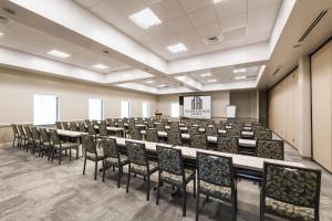 a conference room with a long table and chairs at The Island House Hotel a Doubletree by Hilton in Orange Beach +30 photos