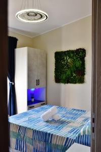 a bedroom with a bed and a painting on the wall at Casa Anna in Santa Maria +82 photos