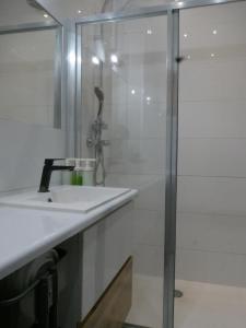 a bathroom with a sink and a shower at Spacious 3 room apartment in center perfect for family or a group of friends in Warsaw +19 photos