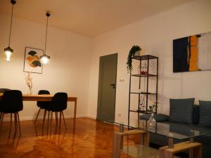 a living room with a couch and a table at Spacious 3 room apartment in center perfect for family or a group of friends in Warsaw