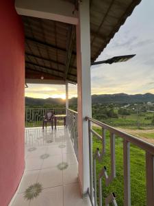 a balcony of a house with a horse on it at Suítes FM in Cavalcante +5 photos