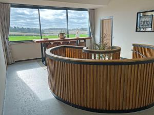 a room with a table and chairs and a large window at Lime Tree House - Uk49477 in Bulmer