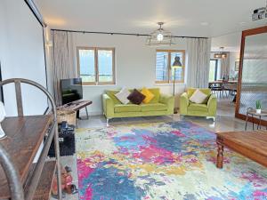 a living room with a colorful rug on the floor at Lime Tree House - Uk49477 in Bulmer