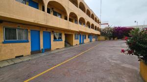 an empty parking lot next to a building at Motel Olvera in Tijuana