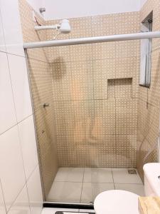 a bathroom with a shower with a toilet at RESIDENCIAL SOPHIA in Eunápolis +5 photos