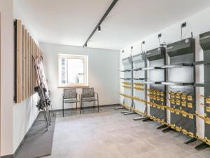 a storage room with shelves and a table and chairs at Haus Tauernblick Top 4 in Jochberg
