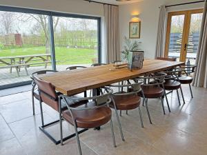 a large wooden table and chairs in a room at Lime Tree House - Uk49477 in Bulmer