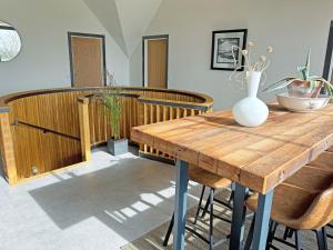 a wooden table with chairs and a vase on it at Lime Tree House - Uk49477 in Bulmer +28 photos