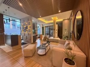 a living room with a couch and a table at Apartasuite Cowork in Bogotá