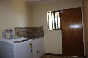 a kitchen with a washing machine and a window at Willunga Farm Retreat in Willunga +55 photos