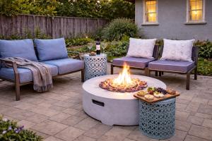 a patio with two chairs and a fire pit at Healdsburg Wine Country Escape with Tasting Perks & Vineyard Views in Healdsburg +13 photos
