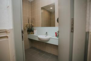 a bathroom with a sink and a mirror at Pearly 16 in Putrajaya
