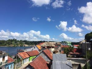 a view of a city with a river and buildings at Hotel Aurora in Flores