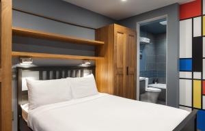 a bedroom with a bed and a bathroom at Vail 21 - CoralTree Residence Collection in Vail