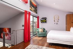 a bedroom with a large bed and a fireplace at Vail 21 - CoralTree Residence Collection in Vail