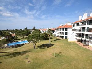 an aerial view of a building with a large yard at Sunny Balcony Apartment and Pool in Vilamoura