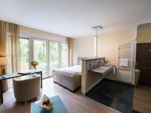 Postel nebo postele na pokoji v ubytování Design-Konferenzhotel & Restaurant Steinernes Schweinchen
