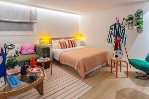 a living room with a bed and a couch at Anook Hotel Incheon Bupyeong in Incheon +89 photos
