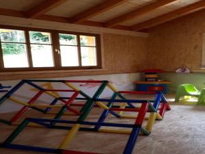 a room with a play room with colorful play equipment at Feriendorf Reinskopf in der Eifel in Schönecken +32 photos