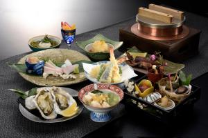 a table with many different types of food on it at umashiyado ryoutei minoshima in Kaino
