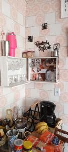 a kitchen with a counter top with some bananas on it at Pousada Maria Guapa 2 in São Gabriel