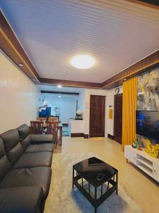 a living room with a couch and a table at ErrZ Homestay in Malaybalay in Malaybalay