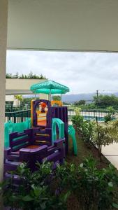 a playground with a play equipment in a park at Refúgio com estilo 2 Quartos 6 Pessoas in Bertioga