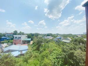 a view of a city with trees and buildings at Khách sạn Ruby - Gần trung tâm khảo thí in Cầu The