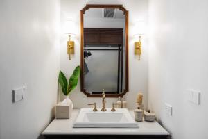 a bathroom with a sink and a mirror at Hotel Kiridara Luang Prabang in Luang Prabang +43 photos