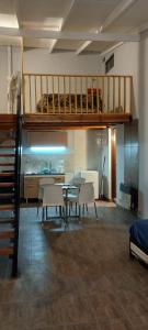a living room with a table and a loft at Relax apart in Trelew