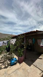 a house with clothes hanging on a clothes line at Parnaíba cantinho do sossego in Parnaíba