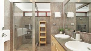 a bathroom with two sinks and a shower at Sea Light in Currarong