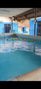 a large swimming pool with a swimming ball in it at Mutiara Chalet in Malacca