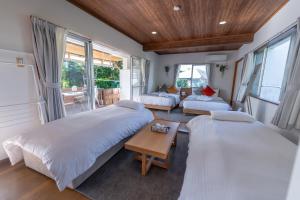 Llit o llits en una habitació de ブーゲンビリア