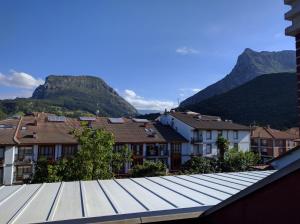 a view of a city with mountains in the background at Hidden Gem in Ramales de la Victoria in Ramales de la Victoria