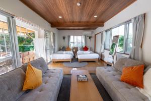 Llit o llits en una habitació de ブーゲンビリア