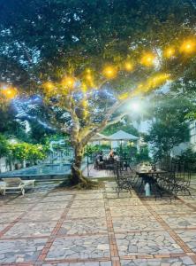 a painting of a tree with lights on it at Tigon Villa in Mỹ Ðuc