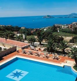 a swimming pool with a view of the ocean at Gli Dei in Pozzuoli