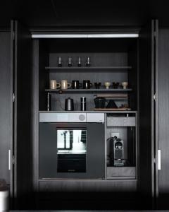 a kitchen with a black and white oven at Goyuhanga in Busan