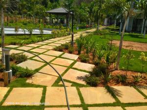 a walkway in a park with a hose at Aarna the Baane in SanivÄrsante