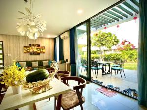 a living room with a table and chairs at 719 - Villa Oceanami - Phước Hải in Long Hai