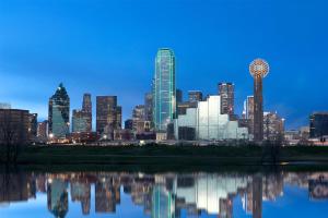 a view of a city skyline at night at Hyatt Regency Dallas in Dallas