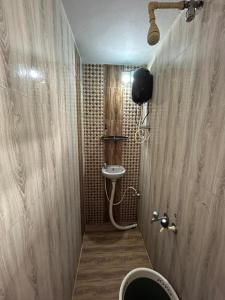a bathroom with a toilet and a sink at Comforts Bhairavi INN in Kalyānpur +31 photos