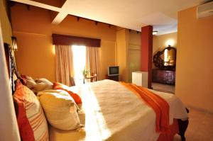 Postel nebo postele na pokoji v ubytování Hotel & Casino Flamboyan